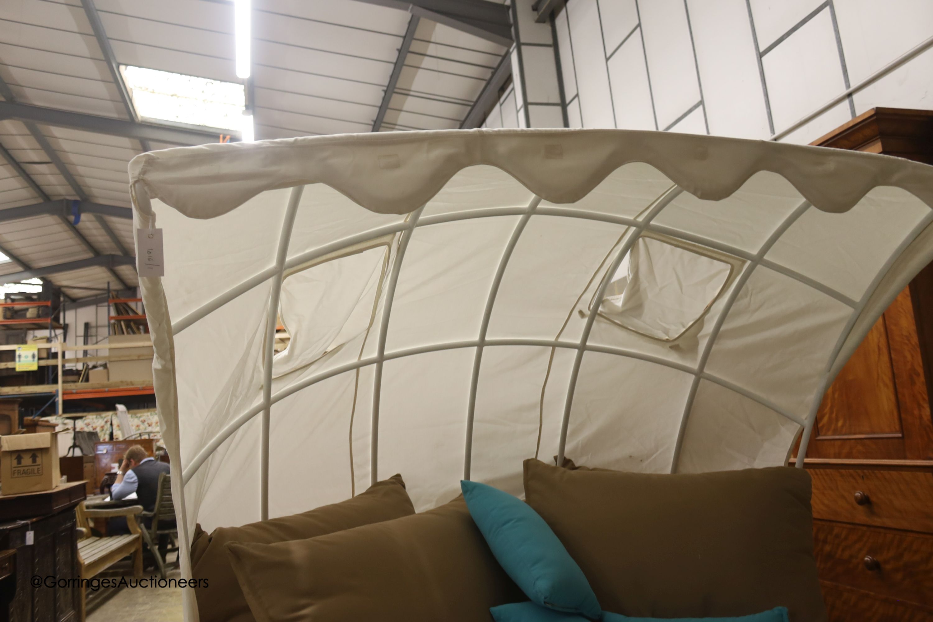 A Bevan Funnel All Weather rattan double garden daybed with metal canopy, mattress and cushions, approx. length 210cm, depth 160cm, height 166cm